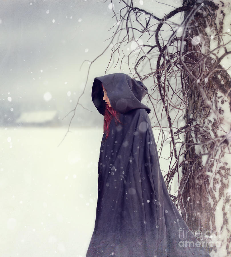 Closeup of woman in cape walking in snow Photograph by Sandra ...