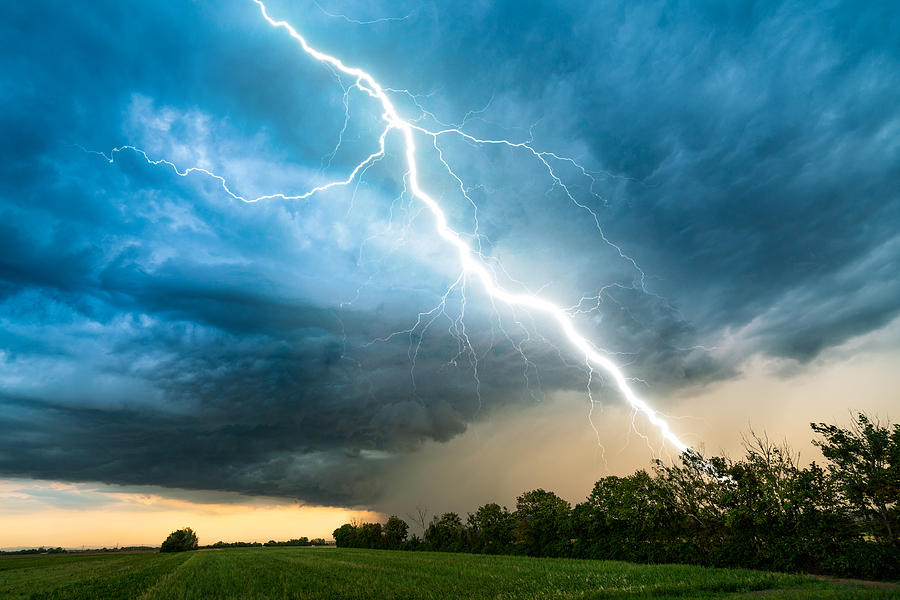 Cloud Storm Sky With Thunderbolt Over Rural Landscape Photograph by Amriphoto