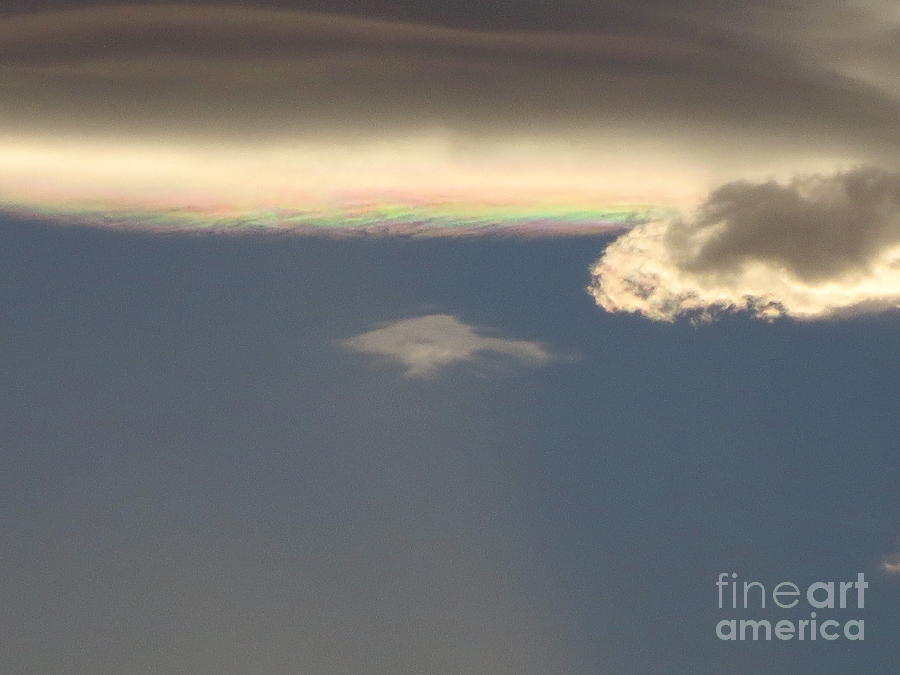 Cloud with Rainbow inside it.  Photograph by Robert Birkenes
