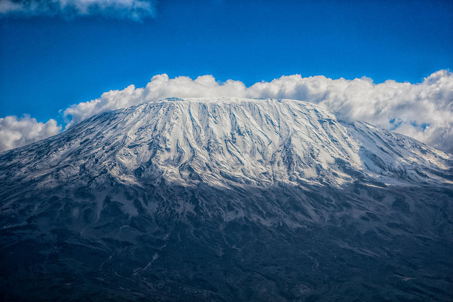 Clouds around Kilimanjaro Photograph by Massimo Mei
