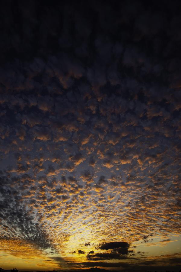 Clouds at dusk in the sky Photograph by Fstoplight