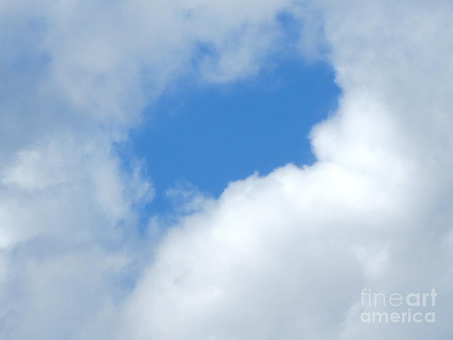 Clouds. Facial profile in blue. Photograph by Robert Birkenes