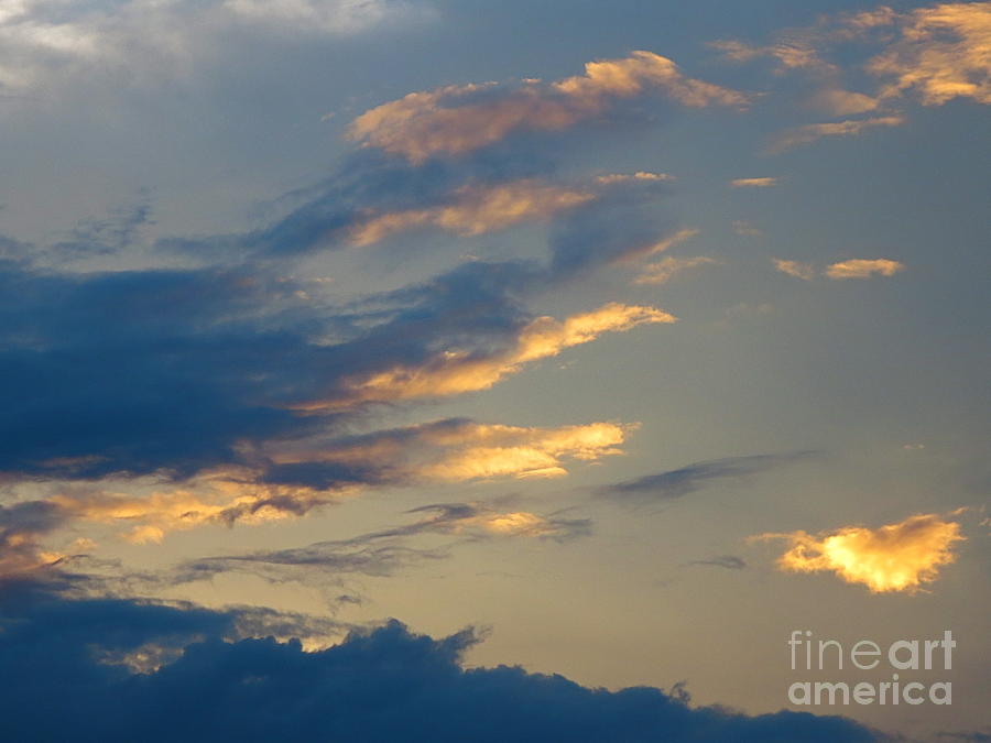 Clouds flaring out at sunset Photograph by Robert Birkenes