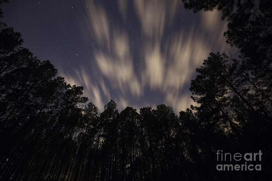 Clouds moving across the night sky Photograph by Jonathan Welch