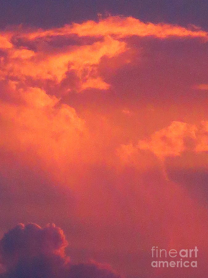 Clouds on Fire. Photographed at sunset. Photograph by Robert Birkenes