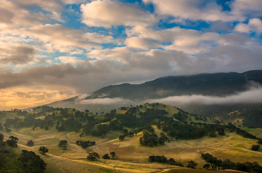 Clouds Over Hills At Sunrise Photograph