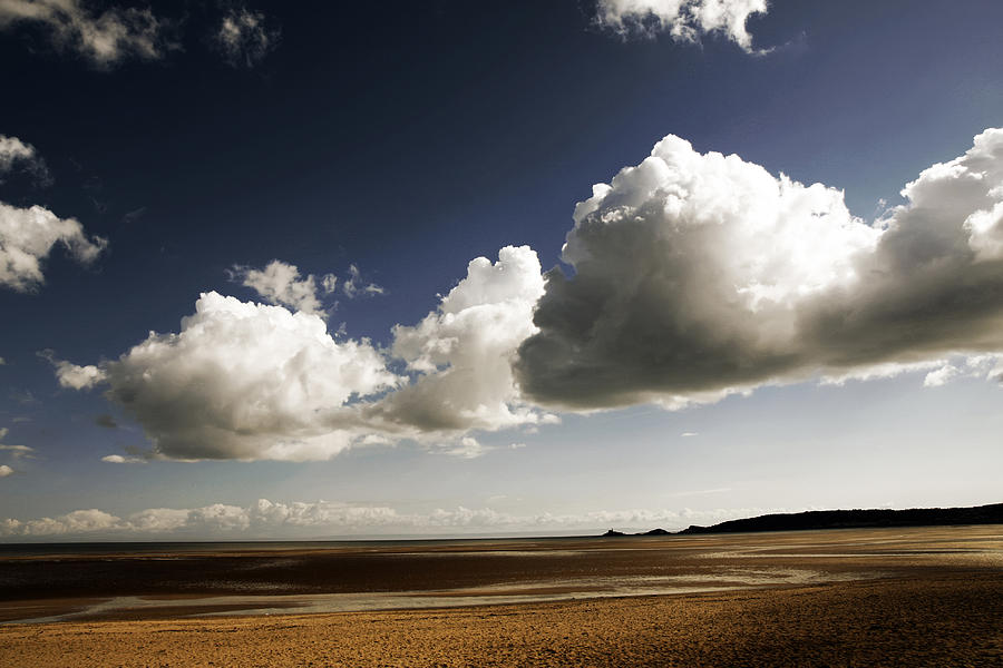 Clouds over Swansea beach Photograph by Steve Ball