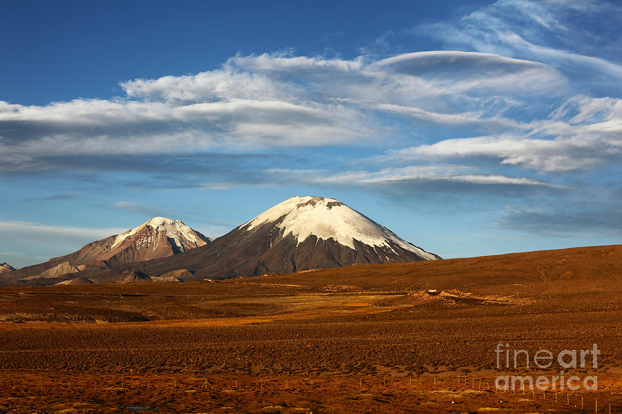 Clouds over the Payachatas volcanos Chile Photograph by James Brunker