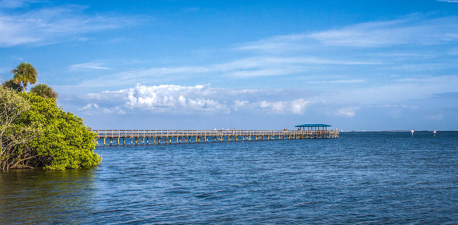 Clouds over the pier Photograph by Jane Luxton