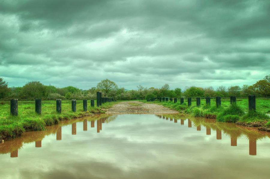 Clouds Reflected In Flood Water Photograph by Image By Debbie Margetts - Ancora Imparo