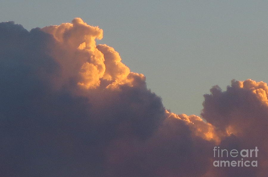 Clouds touched with sun rays at sunset Photograph by Robert Birkenes