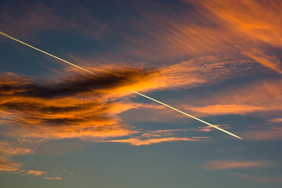 Cloudy Evening Sky With Airplane Photograph by Andreas Berthold