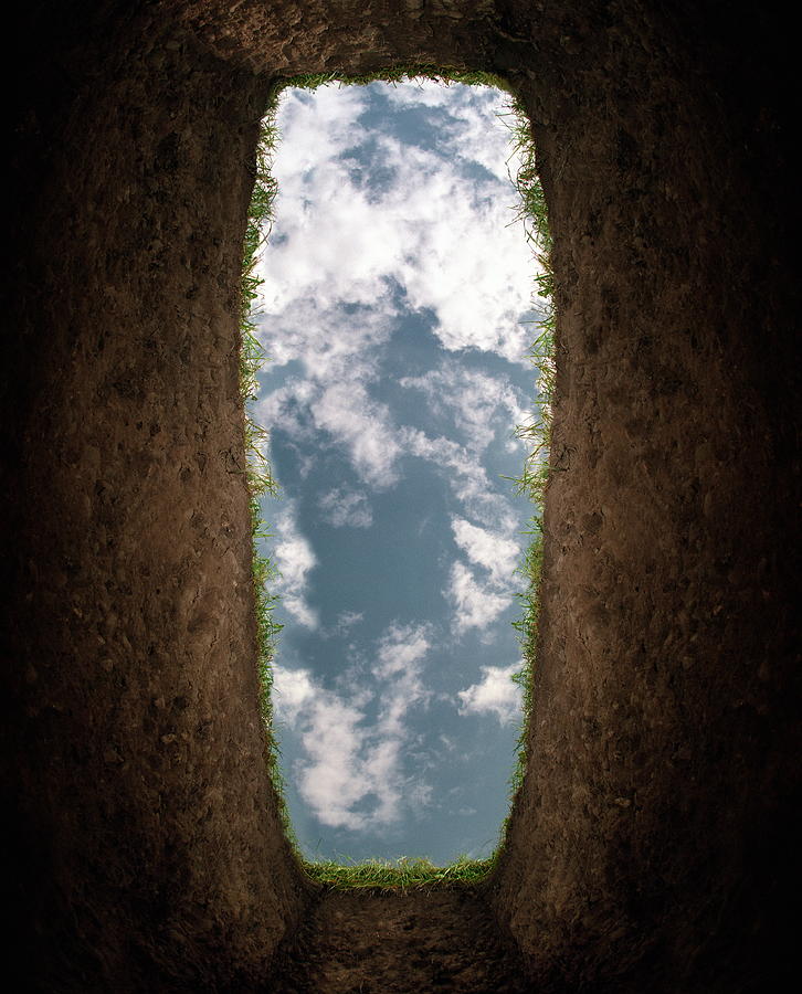 Cloudy sky seen from bottom of grave (Digital Enhancement) Photograph by Alan Thornton