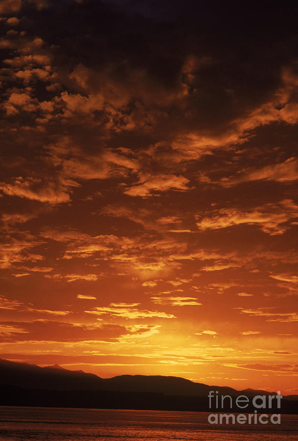 Cloudy Sunset Photograph by Jim Corwin