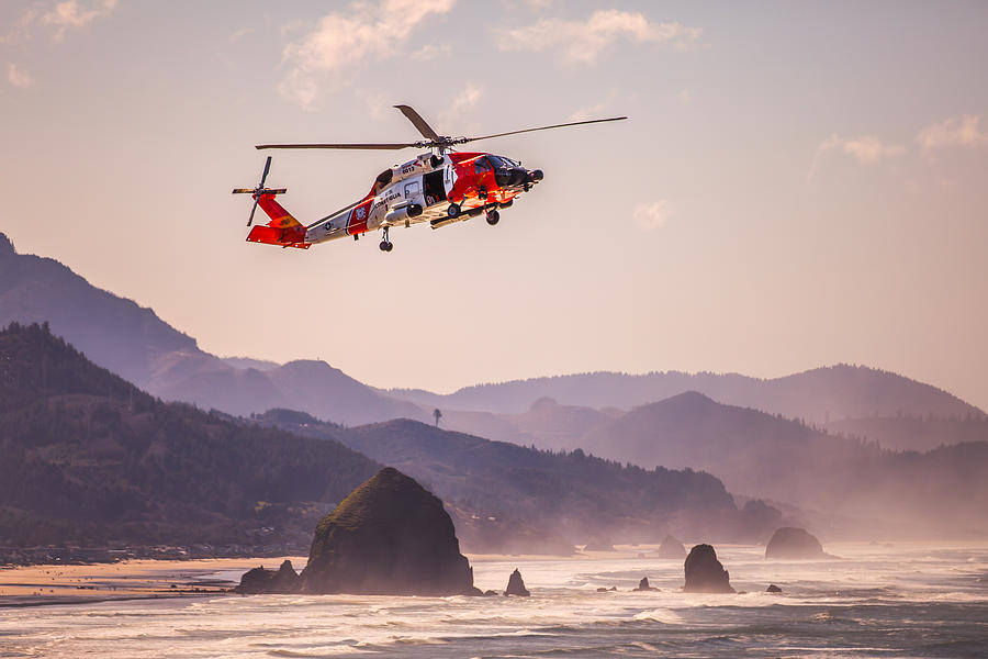 Coast Guard and Haystack Rock Photograph by Joseph Bowman