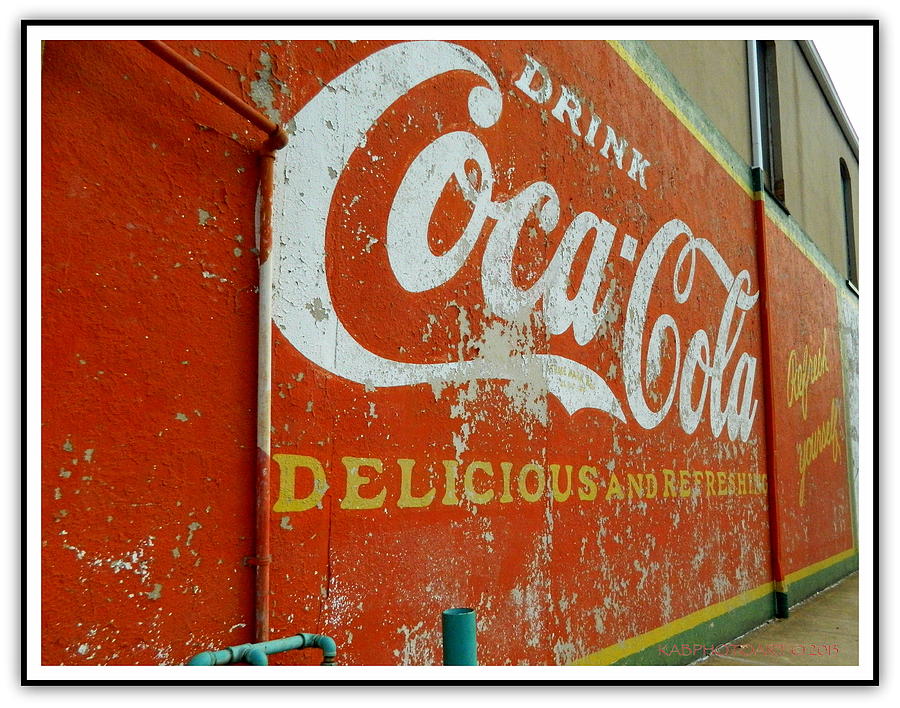 Coca-Cola on the Army Store Wall Photograph by Kathy Barney