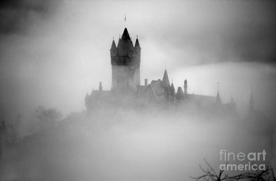 Cochem Castle in the fog Photograph by Rod Jones
