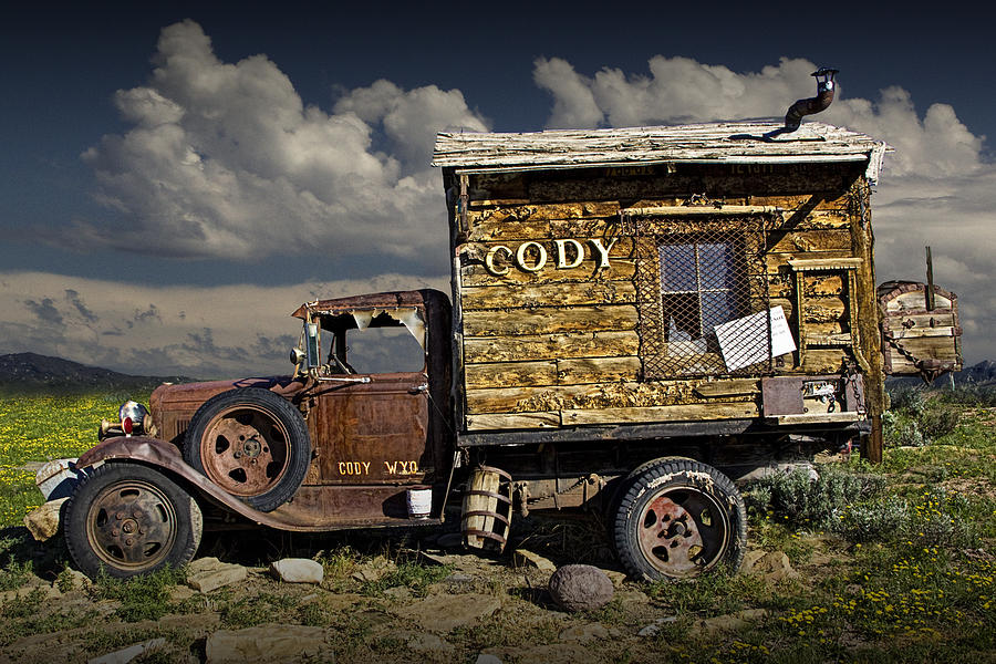 Cody Wyoming Truck Signpost Photograph by Randall Nyhof