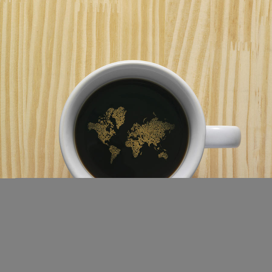 Coffee cup with world map composed of bubbles Photograph by Steve West