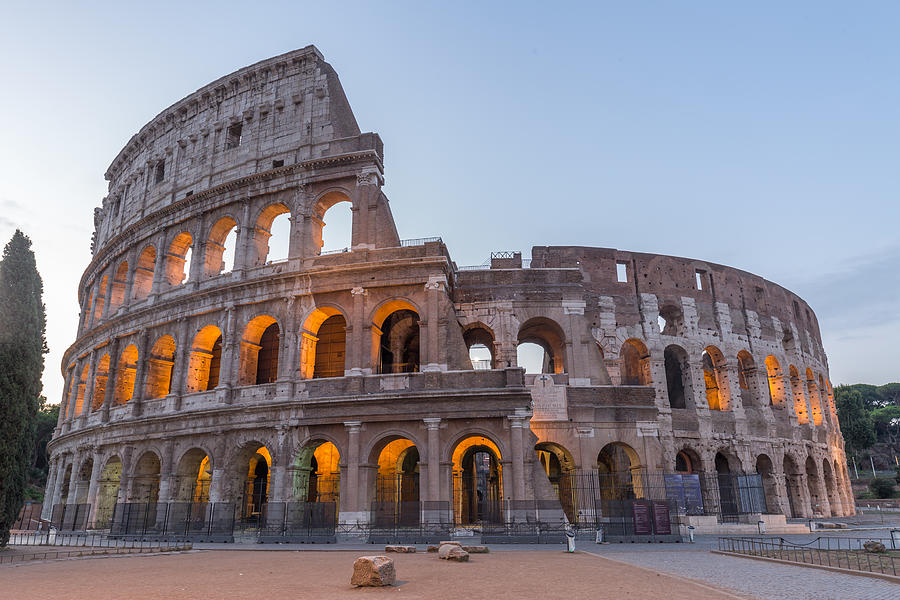 Coliseum in Rome at dusk Photograph by Lupengyu