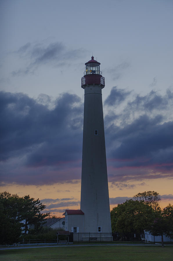 Collorful Skies behind Cape May Lighthouse Photograph by Bill Cannon