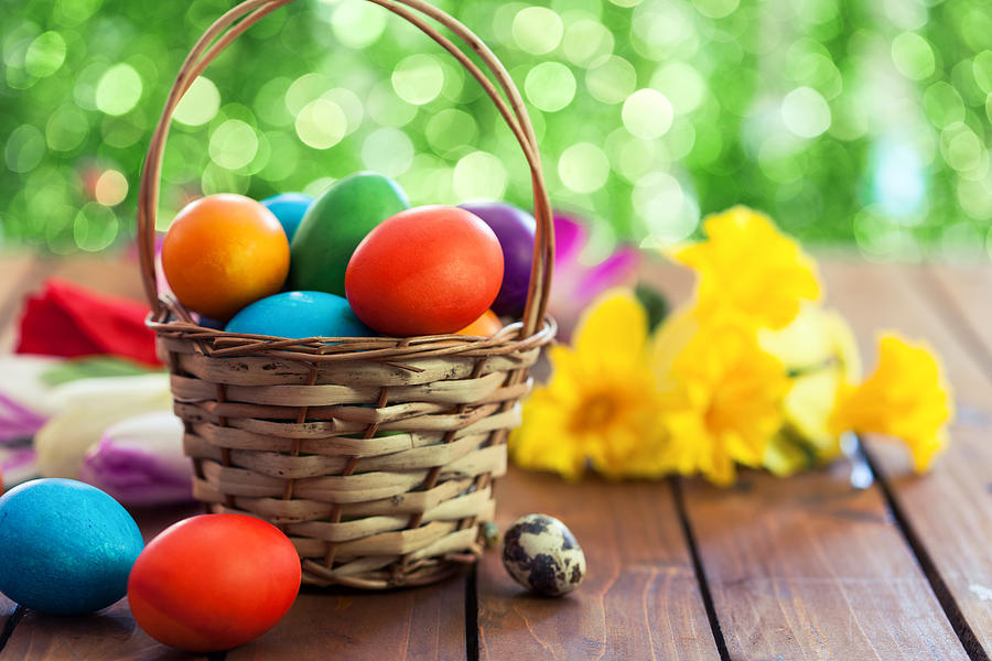 Colored Easter eggs in basket Photograph by Kajakiki
