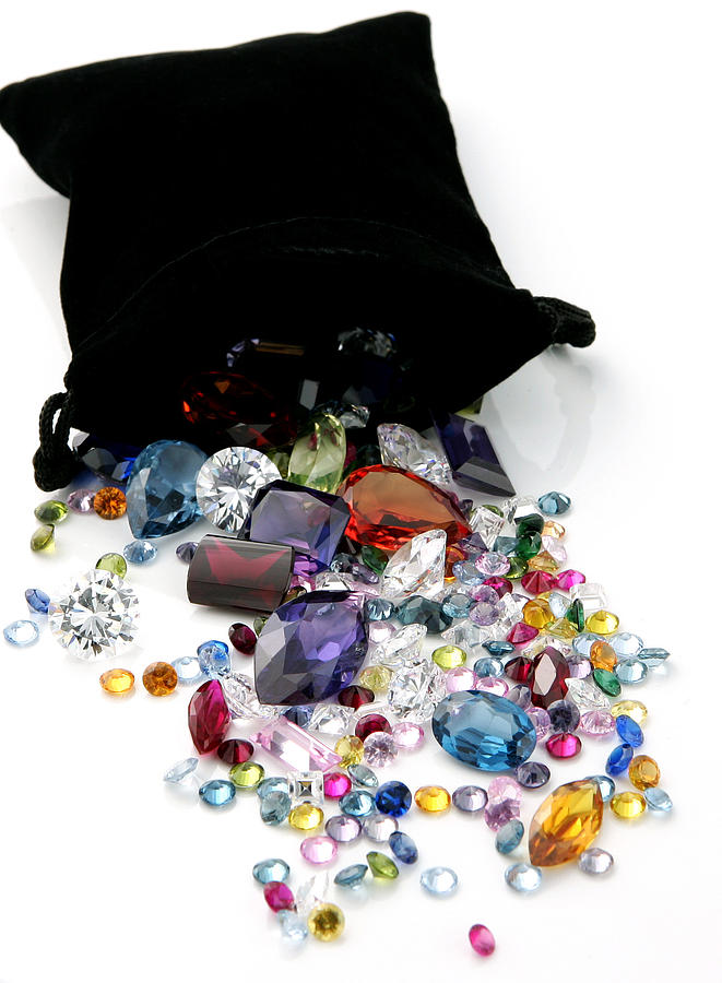 Colored Gemstones Spilling out of Black Bag Photograph by BanksPhotos