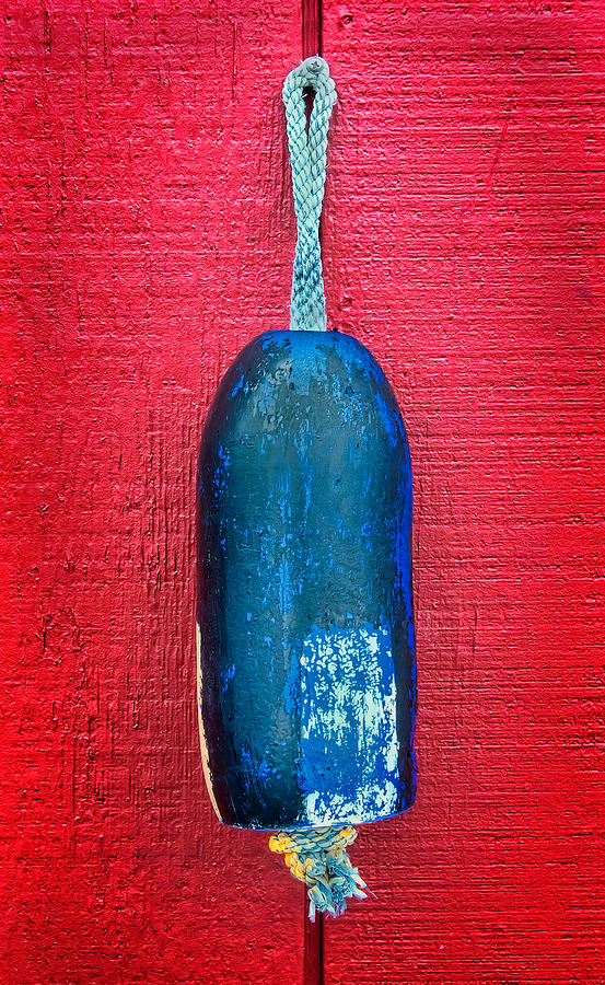 Colorful Buoy Hangs On Bright Red Wall Photograph by Gary Slawsky