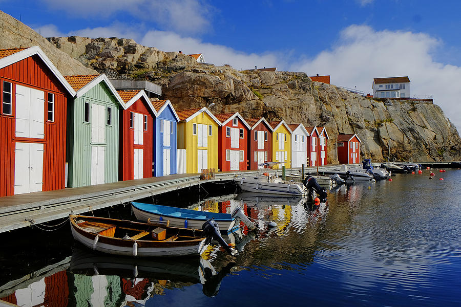 Colorful fishing huts at water Photograph by Johner Images