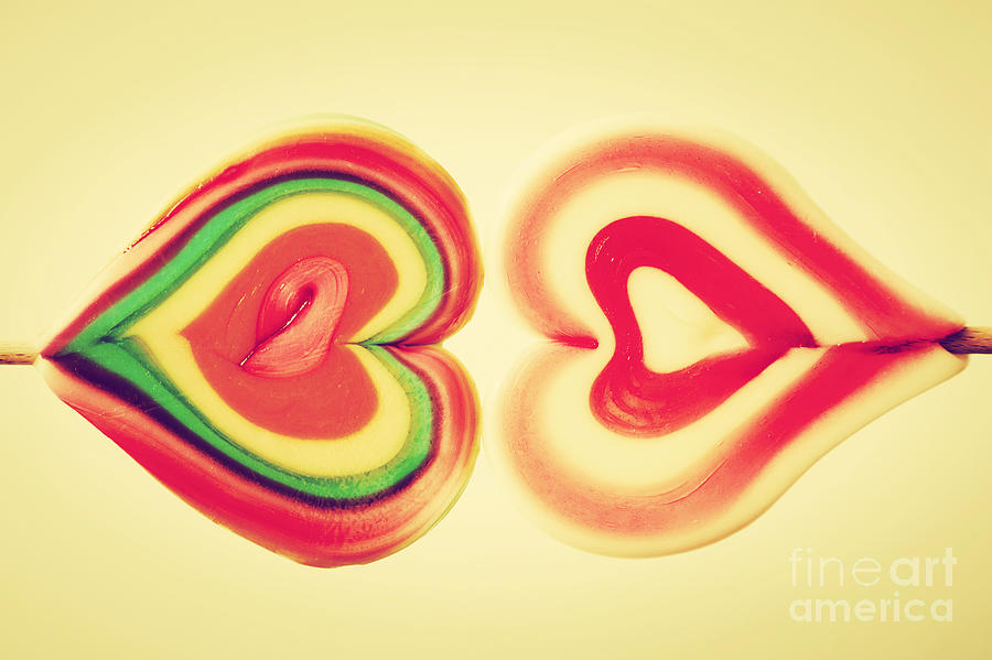 Vintage Photograph - Colorful heart shaped sweet lollipops by Michal Bednarek