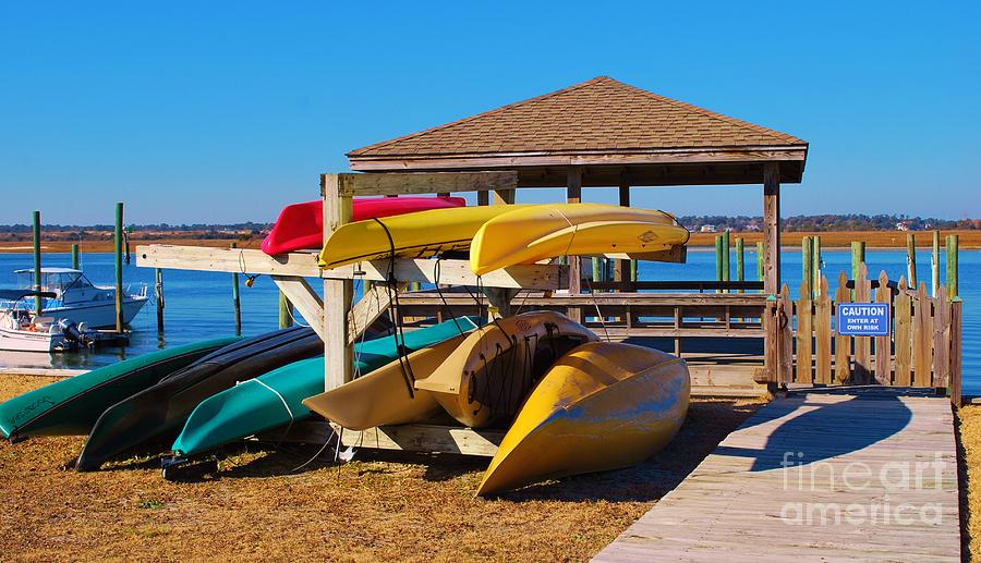Colorful Kayaks And Canoes Photograph by Bob Sample