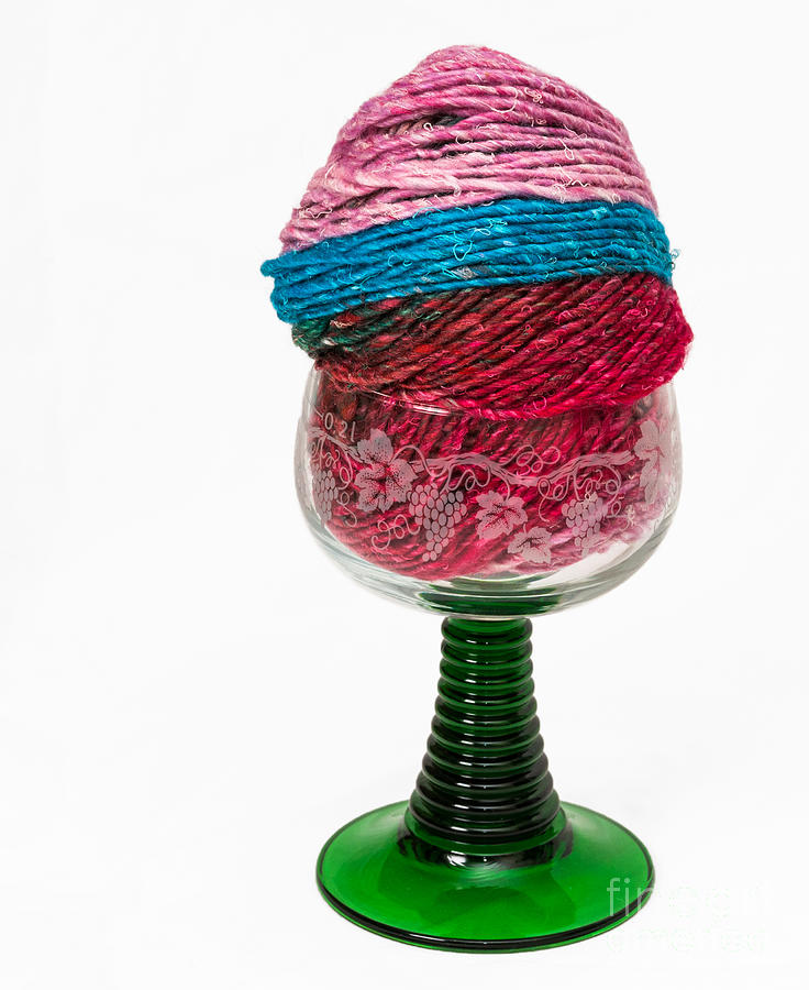 Colorful knitting yarn in a wine glass Photograph by Les Palenik