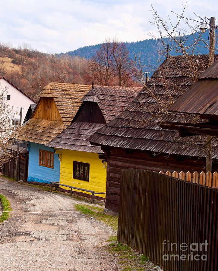Colorful log homes Photograph by Les Palenik