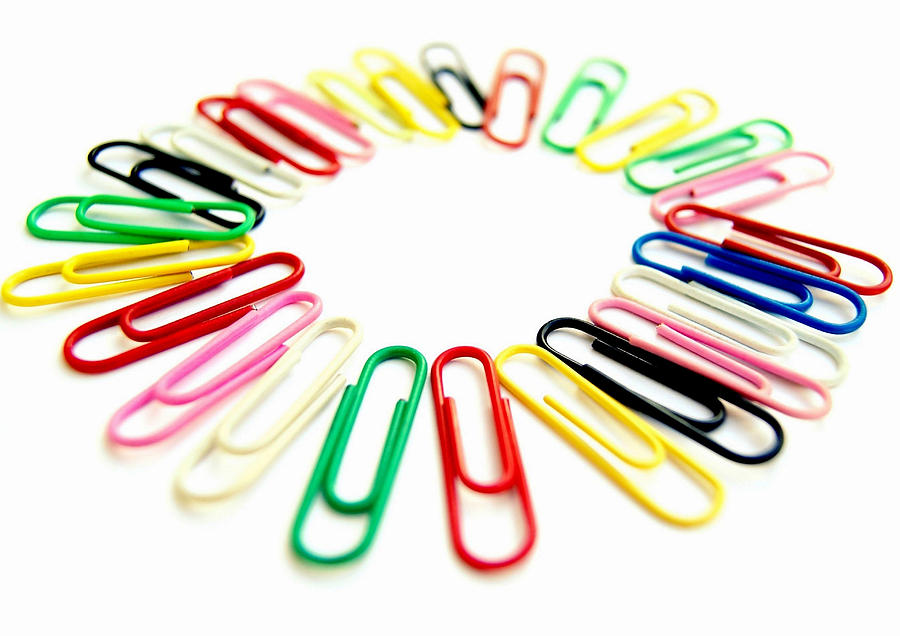 Colorful office clips arranged in a circle in a white background Photograph by Blanchi Costela