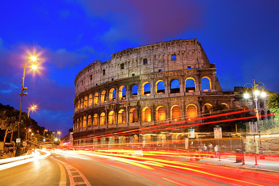 Colosseum And Traffic On Via Del Fori Photograph by Richard Ianson