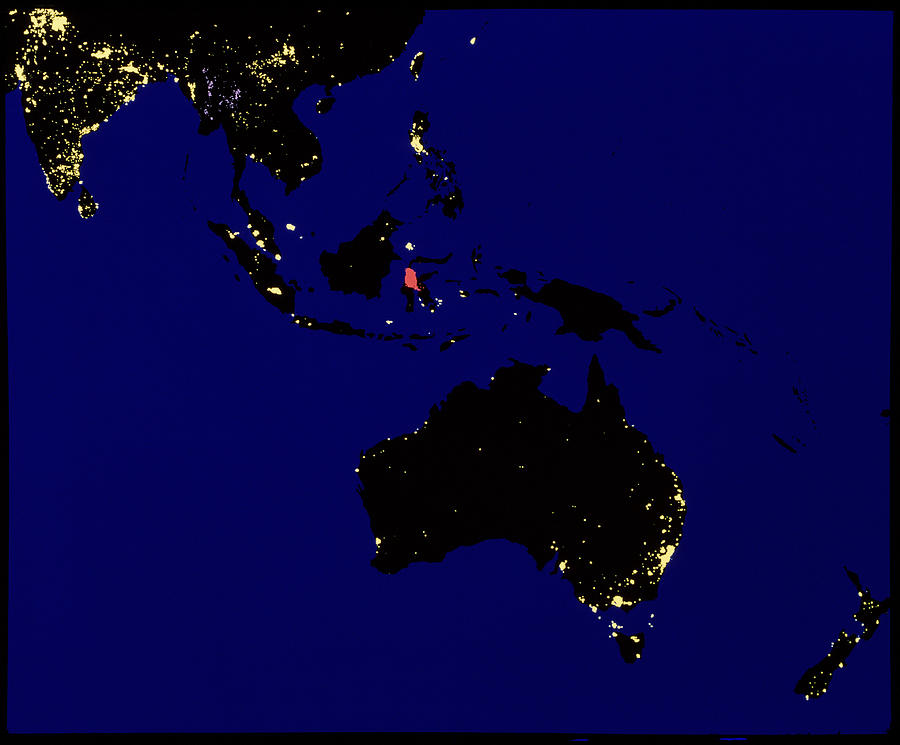 Coloured Satellite Image Of Australasia At Night Photograph by Copyright W.t. Sullivan Iii/science Photo Library