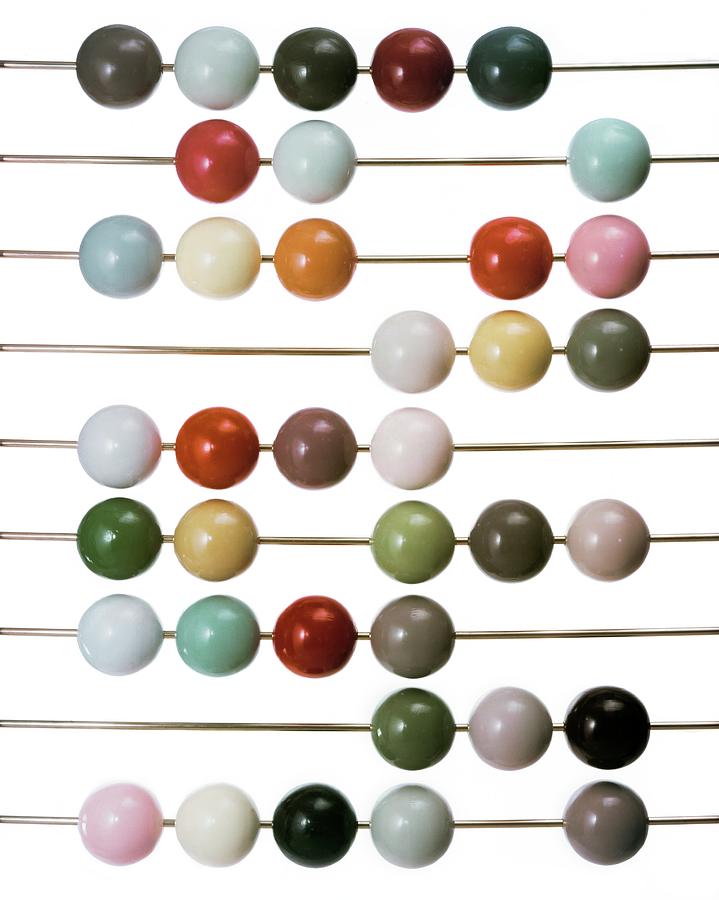Colourful Beads On Metal Rods Photograph by Herbert Matter