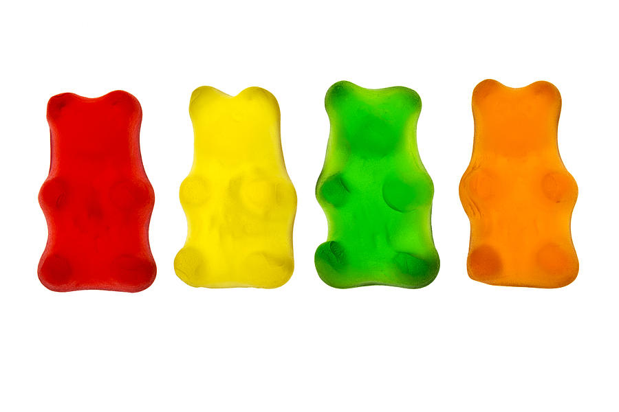Colourful candied gummy bears in a row backlit Photograph by Michael Interisano / Design Pics