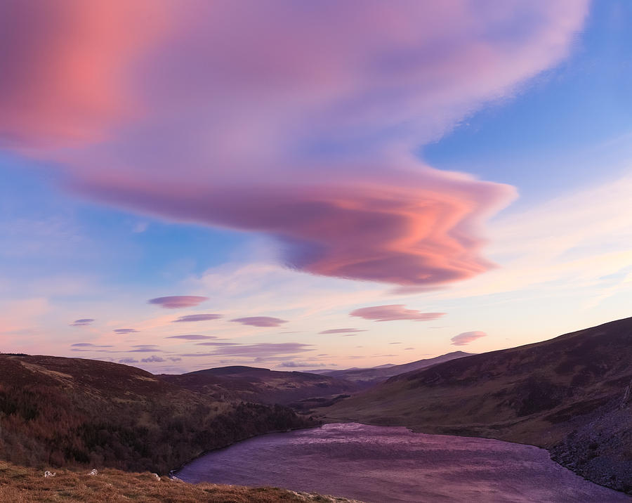 Colourful clouds over Lough Tay in Wicklow Photograph by Semmick Photo