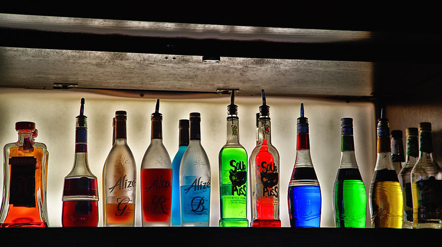 Colourful liquors on a bar rack Photograph by Eti Reid