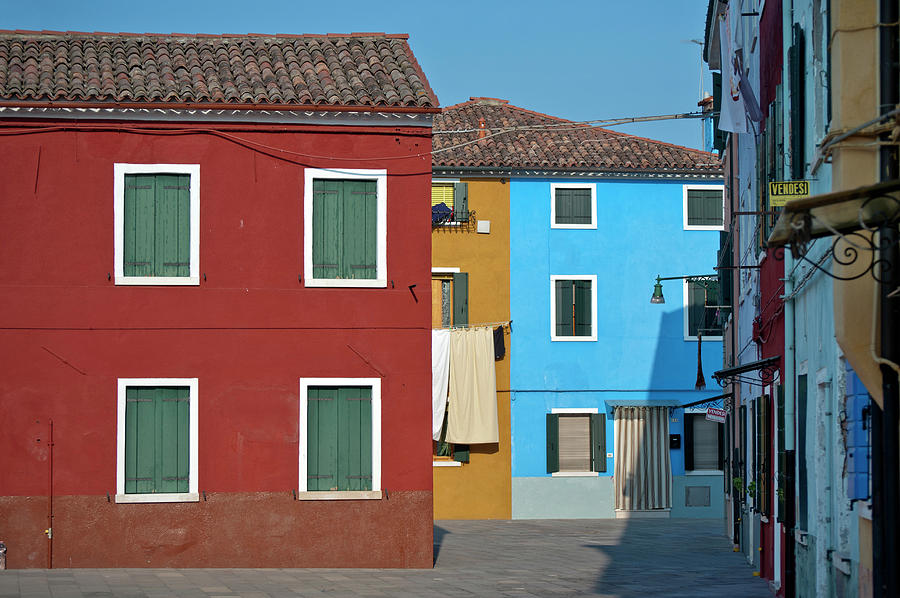 Colourfully Painted Houses On Burano Photograph by Izzet Keribar