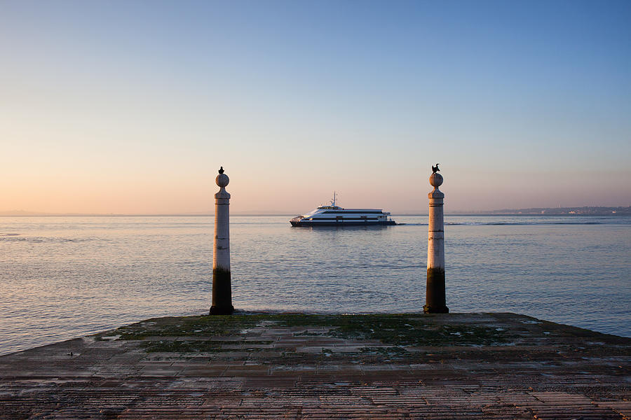 Columns Pier and Tagus River at Sunrise in Lisbon Photograph by Artur Bogacki