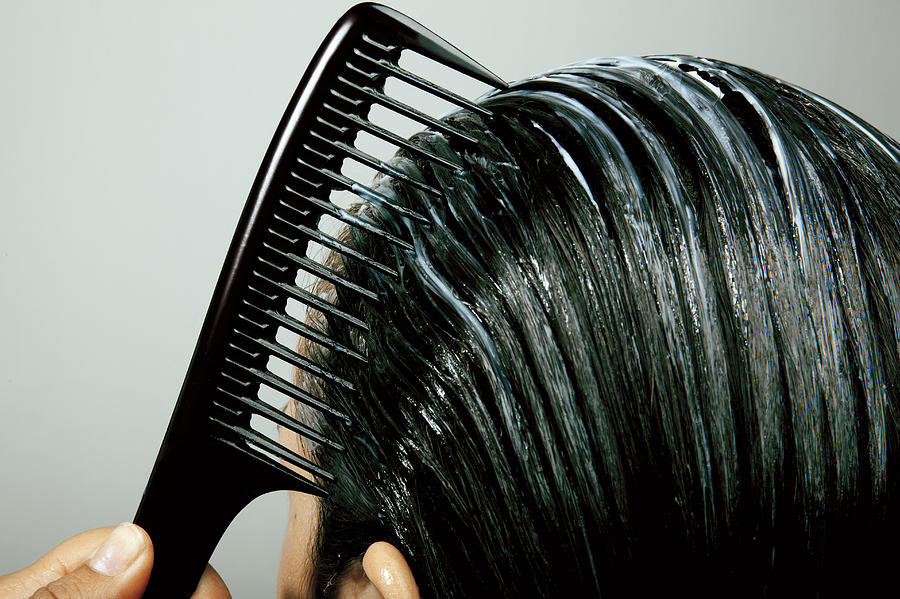 Combing Conditioner Through Hair, Close Up Photograph by Hello World