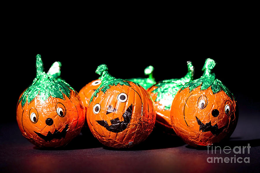 Comedy pumpkin chocolates Photograph by Simon Bratt