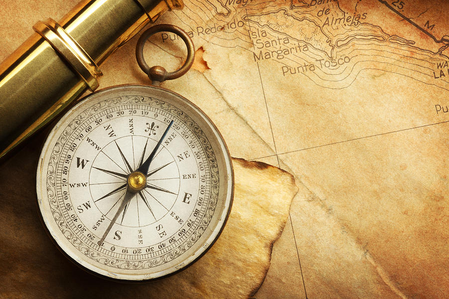 Compass And Spyglass On A Map Photograph by Dny59
