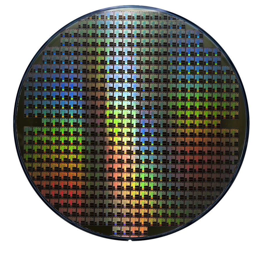 Computer wafer showing rainbow color patterns Photograph by Photomick