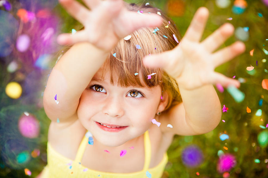 Confetti Falling On Little Girl Photograph by Wundervisuals