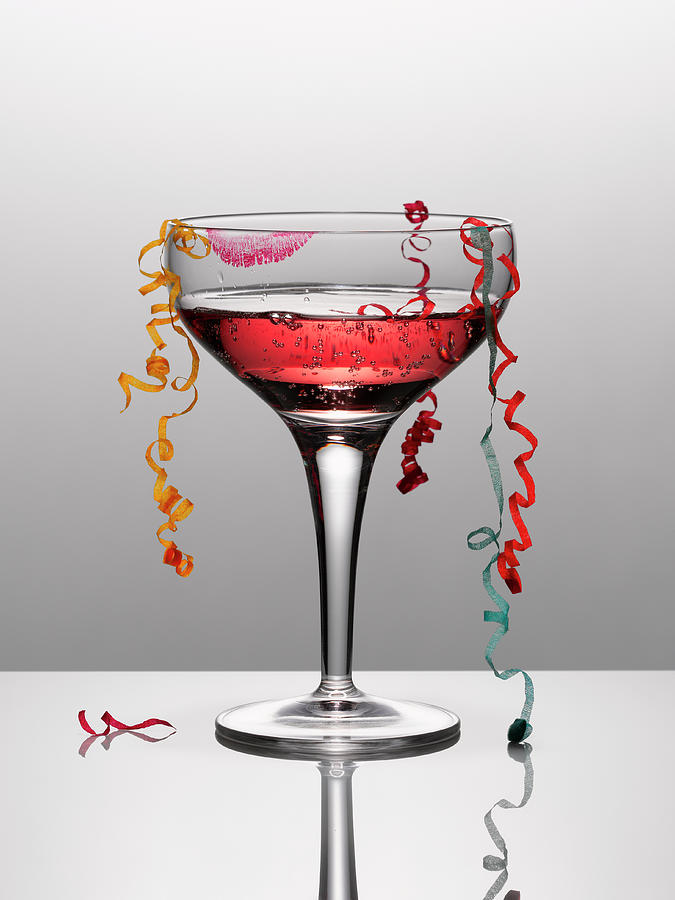 Confetti Hanging From Glass Of Pink Photograph by Andy Roberts Confetti Hanging From Glass Of Pink Photograph by Andy Roberts