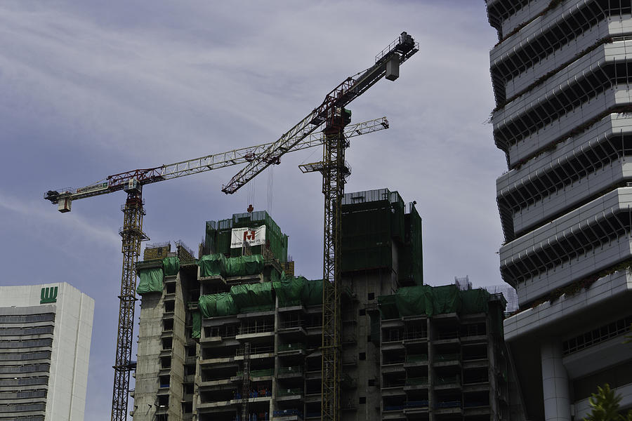 Construction activity on a high rise in Singapore Photograph by Ashish Agarwal