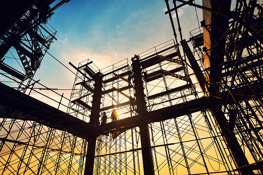 Construction site on sunset background Photograph by Chaiyaporn Baokaew